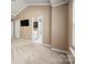 Bright bedroom featuring a modern bathroom, TV, and neutral color scheme at 510 N Alexander St, Charlotte, NC 28202