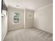 Neutral bedroom featuring natural light, neutral carpet and crown molding at 510 N Alexander St, Charlotte, NC 28202