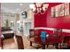 Dining room featuring a round table, seating for four, and an adjacent living room with a fireplace at 510 N Alexander St, Charlotte, NC 28202