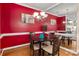 Cozy dining room featuring a round table, four chairs, hardwood floors, and a modern chandelier at 510 N Alexander St, Charlotte, NC 28202