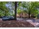 View of townhomes surrounded by mature trees and ample parking spaces at 510 N Alexander St, Charlotte, NC 28202