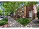Street view of townhomes with mature trees, sidewalks, and well-kept lawns at 510 N Alexander St, Charlotte, NC 28202