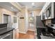 Kitchen with stainless steel appliances, hardwood floors and access to the exterior deck at 510 N Alexander St, Charlotte, NC 28202