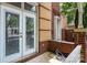 Brick porch with brick railing and lush greenery offers an inviting outdoor space, perfect for relaxing and enjoying the view at 510 N Alexander St, Charlotte, NC 28202