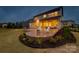Stunning home features a backyard deck, outdoor seating, and lush landscaping; perfect for relaxing or entertaining at 528 Rock Skip Way, Fort Mill, SC 29708