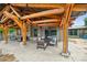 Community pavilion features an outdoor dining table, seating, and wood beams, providing a delightful space at 528 Rock Skip Way, Fort Mill, SC 29708