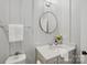 This bathroom has gray walls, a round mirror, and a sink with white counter top at 528 Rock Skip Way, Fort Mill, SC 29708