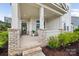 Charming front porch with brick accents, offering a welcoming entry to the home at 528 Rock Skip Way, Fort Mill, SC 29708