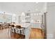 Bright, white kitchen with a large island, stainless steel appliances, and pendant lighting at 528 Rock Skip Way, Fort Mill, SC 29708