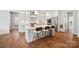 Modern kitchen featuring a large island with seating and stainless steel appliances at 528 Rock Skip Way, Fort Mill, SC 29708