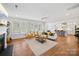 Spacious living room with a fireplace and hardwood floors throughout at 528 Rock Skip Way, Fort Mill, SC 29708