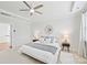 Serene bedroom with ceiling fan, natural light, soft textures, and modern lamps at 528 Rock Skip Way, Fort Mill, SC 29708