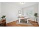 Well-lit home office with hardwood floors, a desk, and a large window at 528 Rock Skip Way, Fort Mill, SC 29708