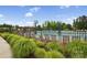 Community pool, surrounded by lush greenery and ample seating, is perfect for relaxation and recreation at 528 Rock Skip Way, Fort Mill, SC 29708