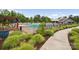 Community pool area with seating and lush green landscaping offers a perfect oasis for relaxation and enjoyment at 528 Rock Skip Way, Fort Mill, SC 29708