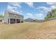 Large backyard with green grass and a screened-in patio at 6070 Trinity Crossing Cir, Kannapolis, NC 28081