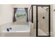 Bathroom featuring a soaking tub, glass-enclosed shower, and stylish tile work for a luxurious feel at 6070 Trinity Crossing Cir, Kannapolis, NC 28081