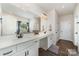 Bathroom showcasing a double sink vanity, modern fixtures, and clean, white cabinetry at 6070 Trinity Crossing Cir, Kannapolis, NC 28081