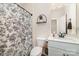 Bathroom featuring a decorative shower curtain, and a vanity with modern fixtures at 6070 Trinity Crossing Cir, Kannapolis, NC 28081