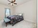 Comfortable bedroom with soft carpet, natural light, and calming tones create a peaceful retreat at 6070 Trinity Crossing Cir, Kannapolis, NC 28081