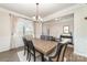 Dining area with wood flooring and decorative trim, next to front door at 6070 Trinity Crossing Cir, Kannapolis, NC 28081
