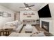 Comfortable living room with a fireplace, ceiling fan, and neutral decor at 6070 Trinity Crossing Cir, Kannapolis, NC 28081