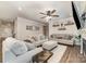 Cozy living room featuring comfortable seating, ceiling fan, and a fireplace at 6070 Trinity Crossing Cir, Kannapolis, NC 28081