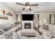 Inviting living room with a fireplace, stylish decor, and lots of natural light at 6070 Trinity Crossing Cir, Kannapolis, NC 28081