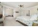 Bright main bedroom featuring a ceiling fan, ensuite access, and plenty of space for relaxation at 6070 Trinity Crossing Cir, Kannapolis, NC 28081