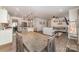 Spacious open-concept kitchen and living room area with hardwood floors and natural light at 6070 Trinity Crossing Cir, Kannapolis, NC 28081