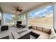 Screened-in back patio with comfortable seating and great views of the backyard at 6070 Trinity Crossing Cir, Kannapolis, NC 28081