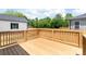 New wood deck with wood railing, perfect for outdoor entertaining at 640 Central Nw Dr, Concord, NC 28027