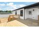 A wood deck on home's exterior leads to a white door and fenced in yard at 640 Central Nw Dr, Concord, NC 28027