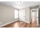 Bedroom has hardwood flooring, neutral walls, bright light, and an overhead light fixture at 640 Central Nw Dr, Concord, NC 28027