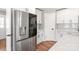 Kitchen with stainless fridge, white cabinets, and quartz countertops at 640 Central Nw Dr, Concord, NC 28027