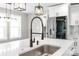 Close up on new kitchen with modern faucet, island and stone countertops at 640 Central Nw Dr, Concord, NC 28027