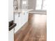 View of the kitchen island that features white cabinets and a quartz countertop at 640 Central Nw Dr, Concord, NC 28027