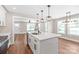 Spacious kitchen with quartz countertops, hardwood floors, and an island at 640 Central Nw Dr, Concord, NC 28027