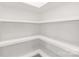 Bright pantry features white walls and shelving offering ample storage space at 640 Central Nw Dr, Concord, NC 28027