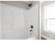 Bathtub and shower feature built-in shelves and an adjustable shower head at 640 Central Nw Dr, Concord, NC 28027