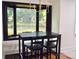 Cozy dining area featuring a black table set and large window with a view of the outdoors at 645 Wilshire Sw Ave, Concord, NC 28027