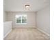 Bonus room with plush carpeting, a large window, and neutral paint colors at 726 Centennial St, Gastonia, NC 28056
