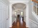 Inviting foyer with hardwood floors and views of the living room with a fireplace and staircase at 726 Centennial St, Gastonia, NC 28056
