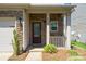 Close-up of a home's front porch showcasing stone accents and a decorative front door at 726 Centennial St, Gastonia, NC 28056