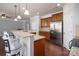 Kitchen with granite countertops, stainless steel appliances, breakfast bar, and hardwood floors at 726 Centennial St, Gastonia, NC 28056