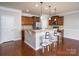 Kitchen showcases granite countertops, stainless steel appliances, breakfast bar, and dark wood cabinets at 726 Centennial St, Gastonia, NC 28056