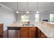 Kitchen sink sits below granite countertops with stainless steel appliances, and tile backsplash at 726 Centennial St, Gastonia, NC 28056