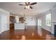 The living room has an open floor plan, hardwood floors, a ceiling fan, and a fireplace at 726 Centennial St, Gastonia, NC 28056