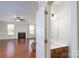 Open-concept living room showcasing hardwood floors, a fireplace, and access to a half bathroom at 726 Centennial St, Gastonia, NC 28056