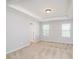 A main bedroom has plush carpeting, neutral paint colors, two large windows, and tray ceilings at 726 Centennial St, Gastonia, NC 28056